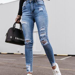 RIPPED LIGHT WASH SKINNY JEANS